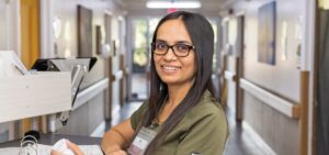 Oakwood Gardens nurse in the hallway at a nurses cart