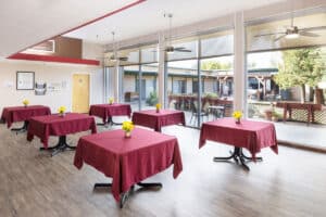 Oakwood Gardens dining table with flower centerpiece