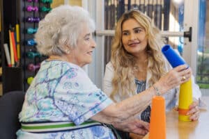 Nurse with resident in the rehab gym