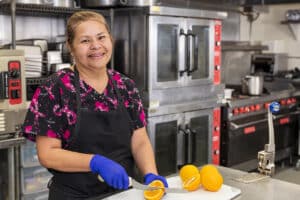 Oakwood chef in the kitchen cutting oranges