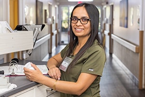 Oakwood Gardens nurse in the hallway at a nurses cart