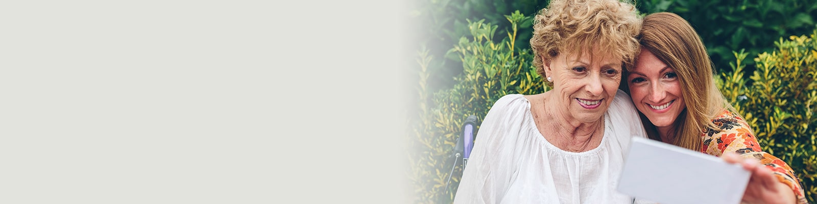 Mother and daughter looking at an iPad