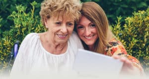 Mother and daughter looking at an iPad